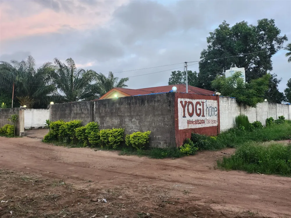Yogi Home sign at the guest house wall